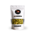 ROSTRO premium green cardamom pouch displayed on a rock with a natural plantation background.